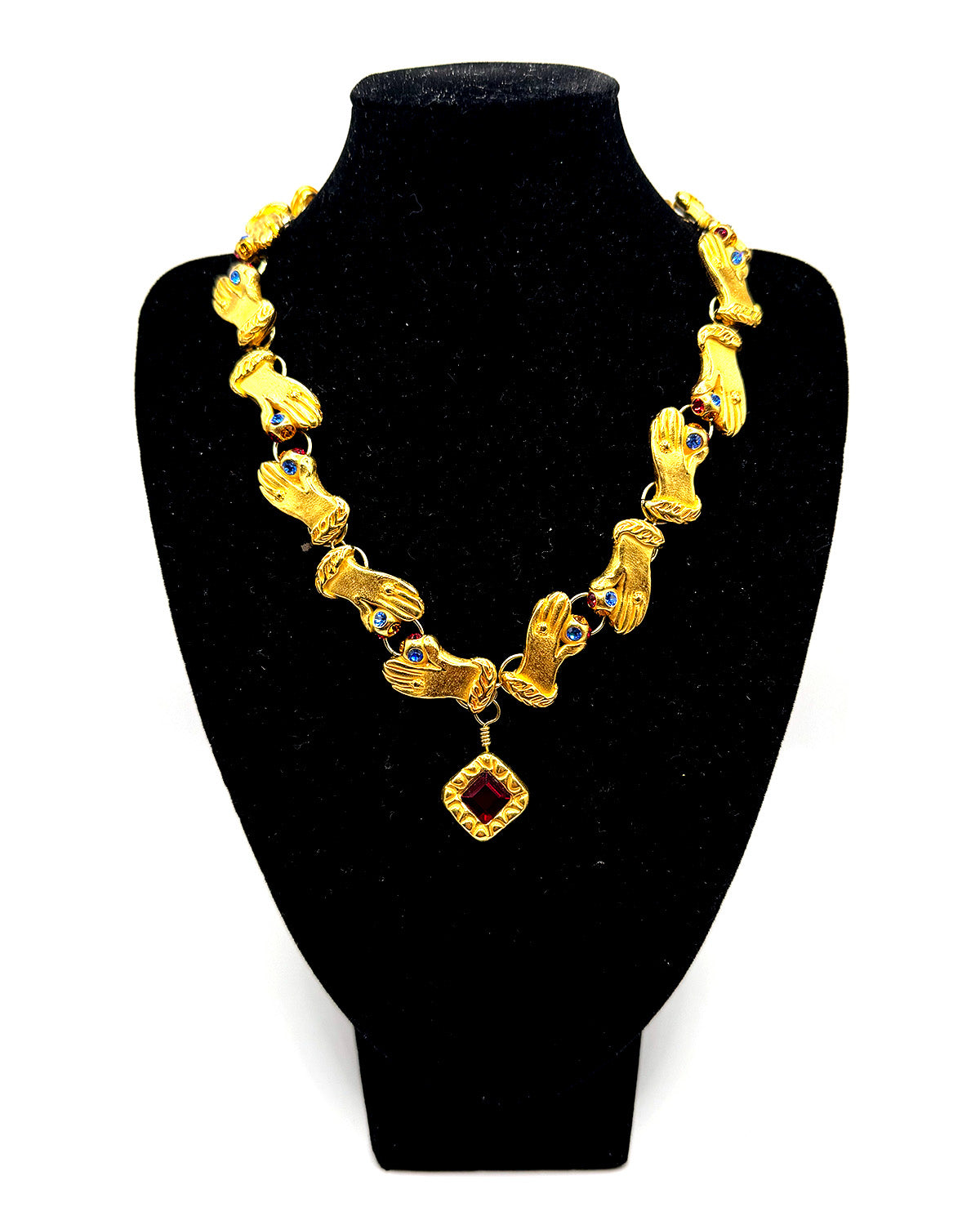 Hands with Red Jewel Necklace